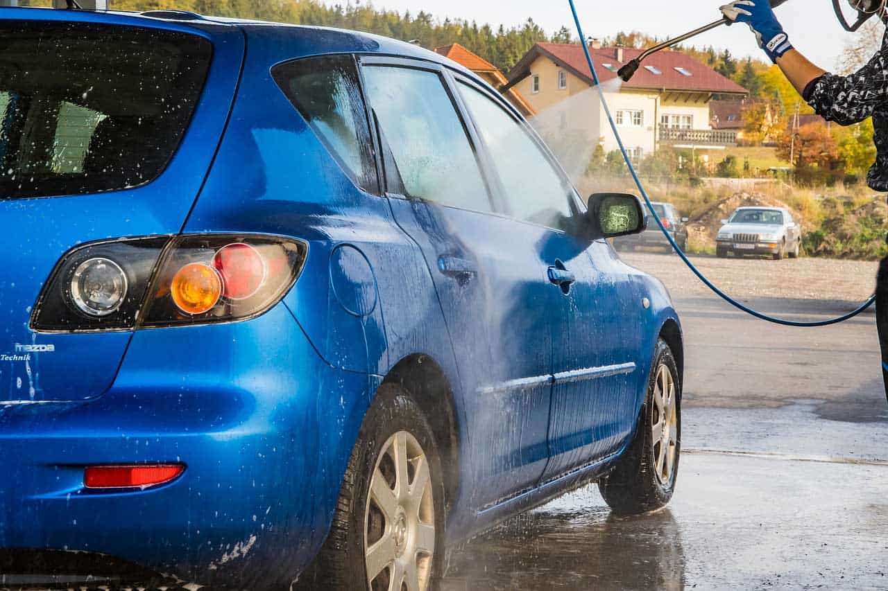 Washing a car with a pressure washer