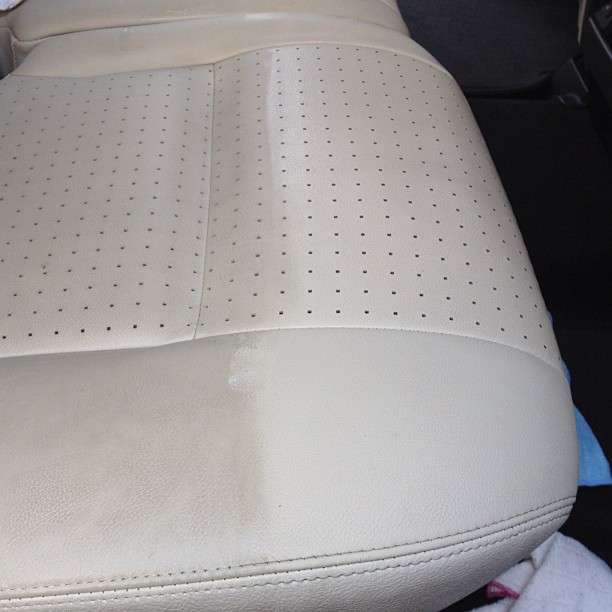 cleaning a dirty car seat